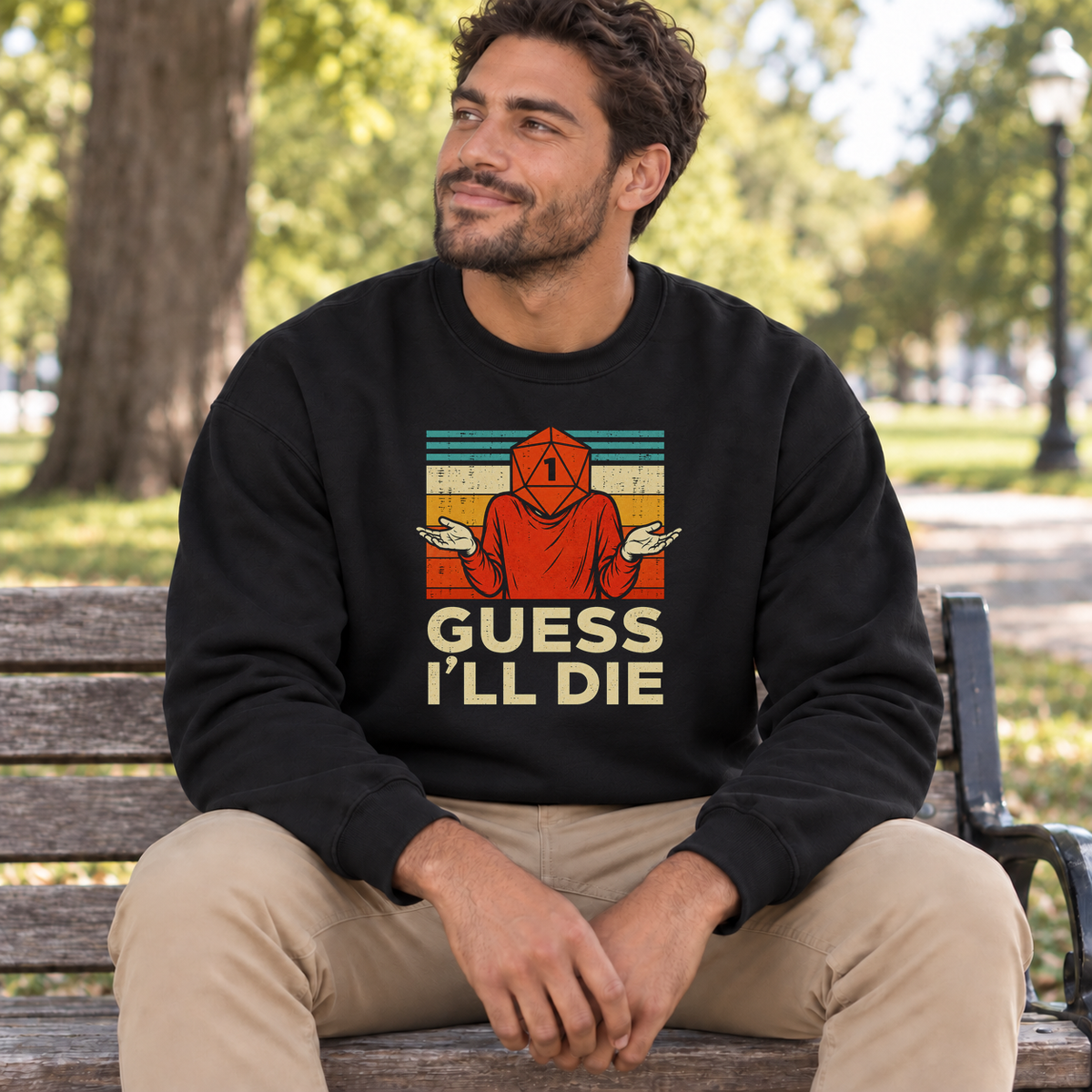 Guess I’ll Die black DnD sweatshirt worn by a man in a park