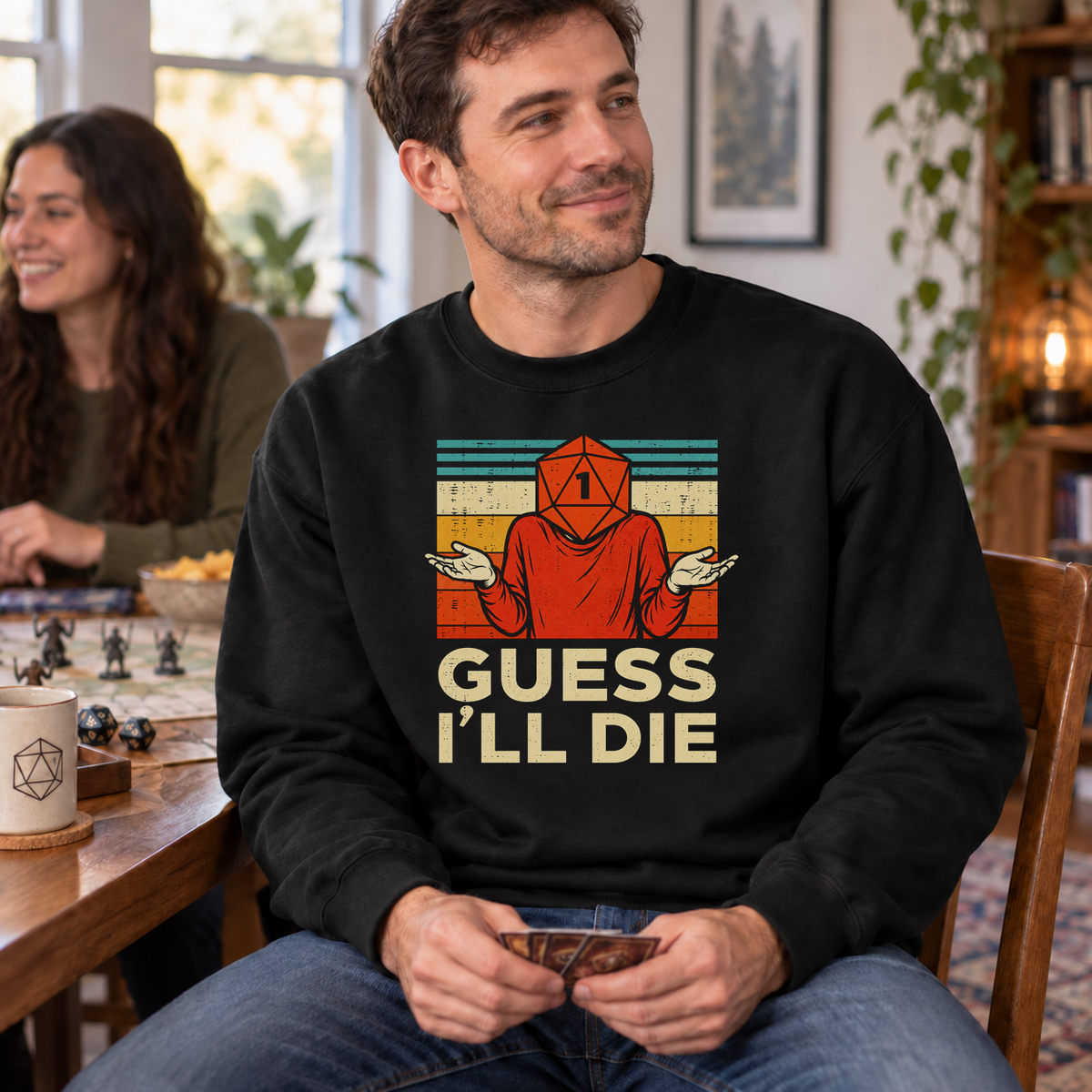 Guess I’ll Die black DnD sweatshirt worn by a man at game night