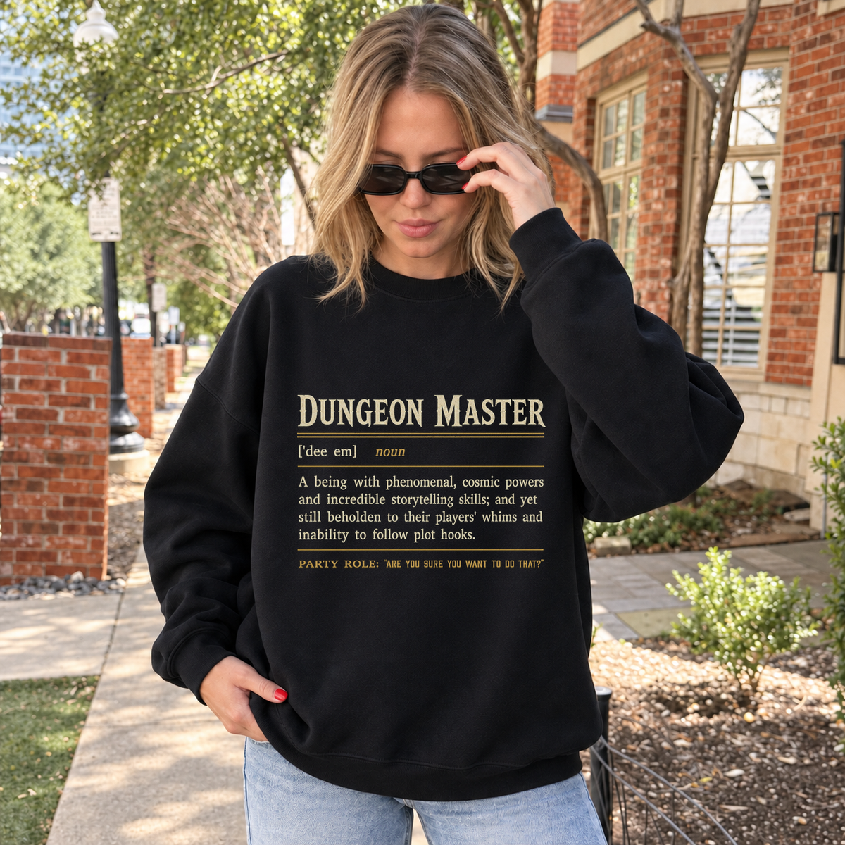 Dungeon Master Definition black DnD sweatshirt worn by a woman outdoors
