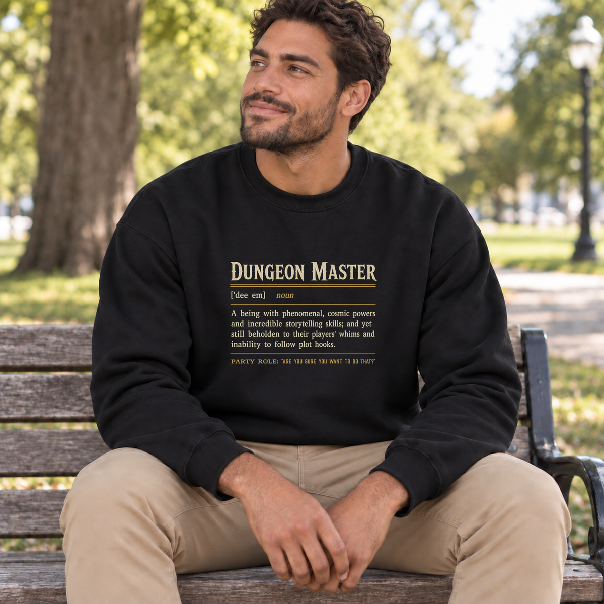 Dungeon Master Definition black DnD sweatshirt worn by a man in a park