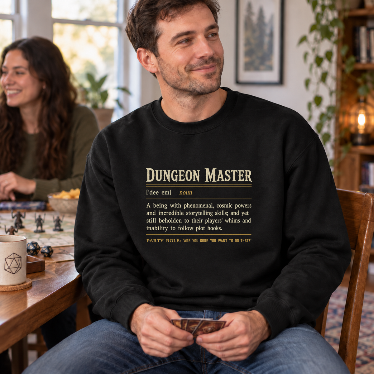 Dungeon Master Definition black DnD sweatshirt worn by a man at game night