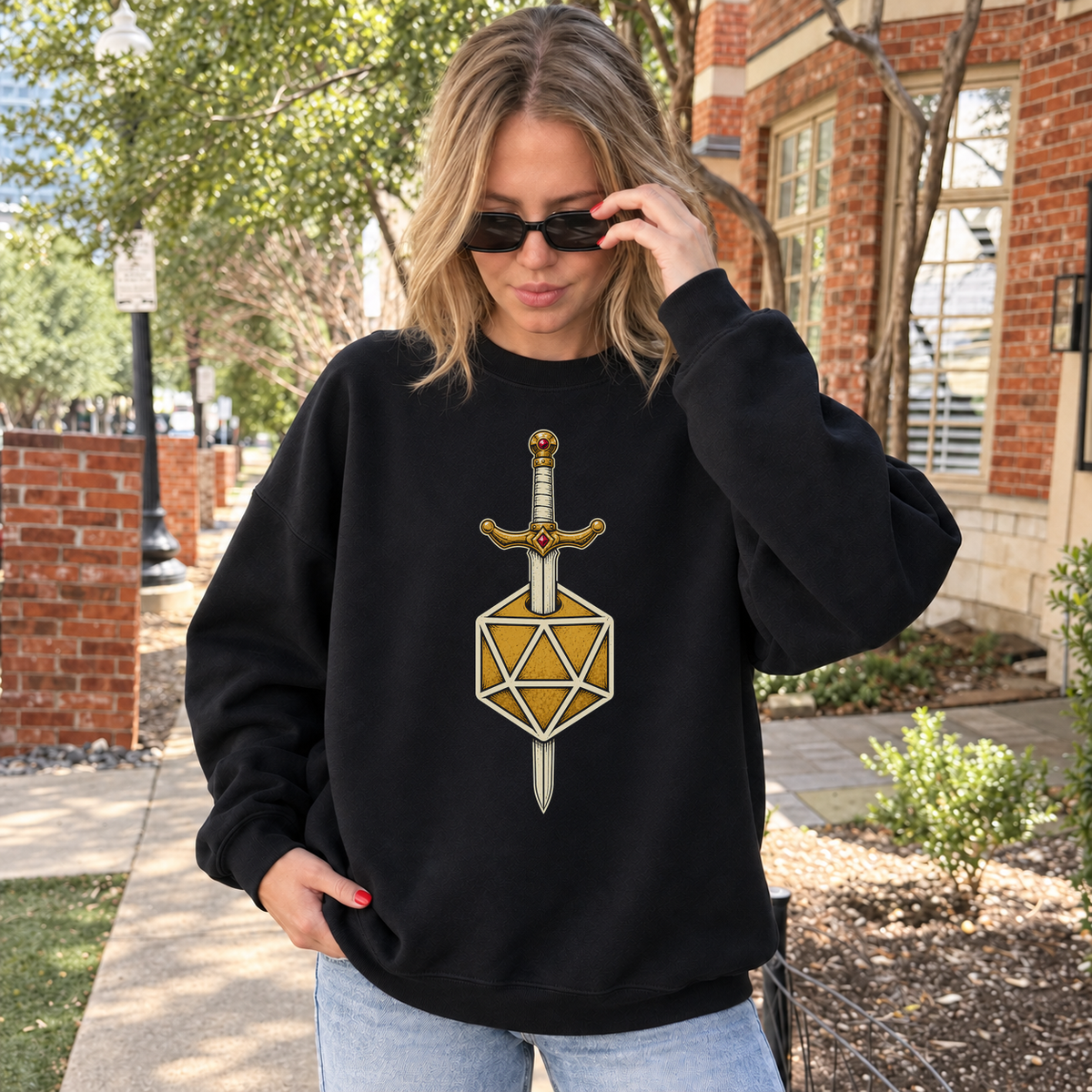 Sword & D20 black DnD sweatshirt worn by a woman outdoors