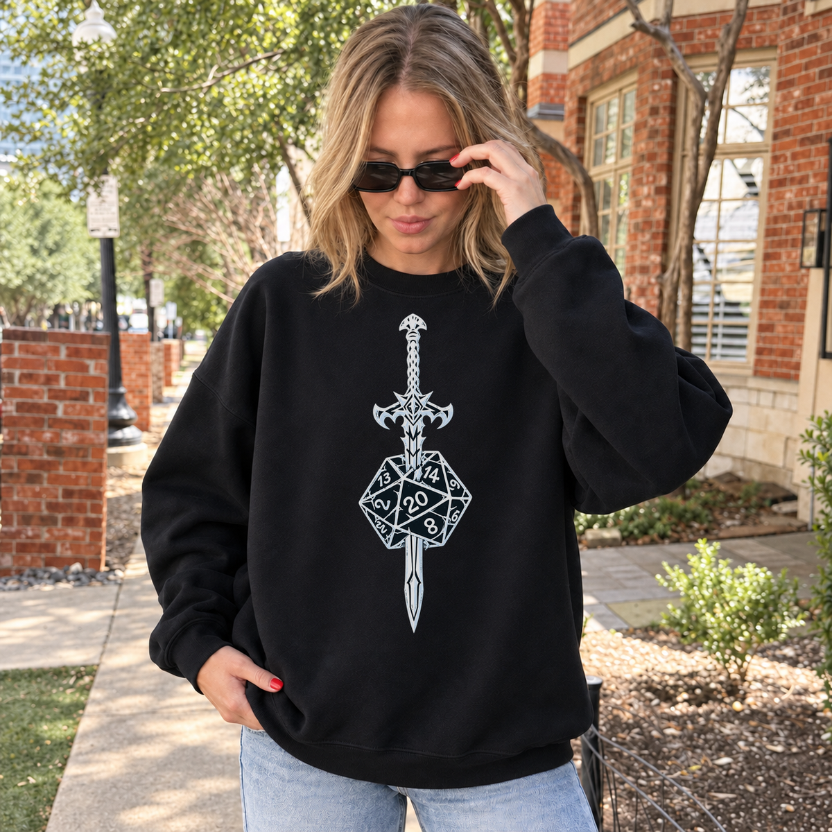 Sword & Dice black DnD sweatshirt worn by a woman outdoors