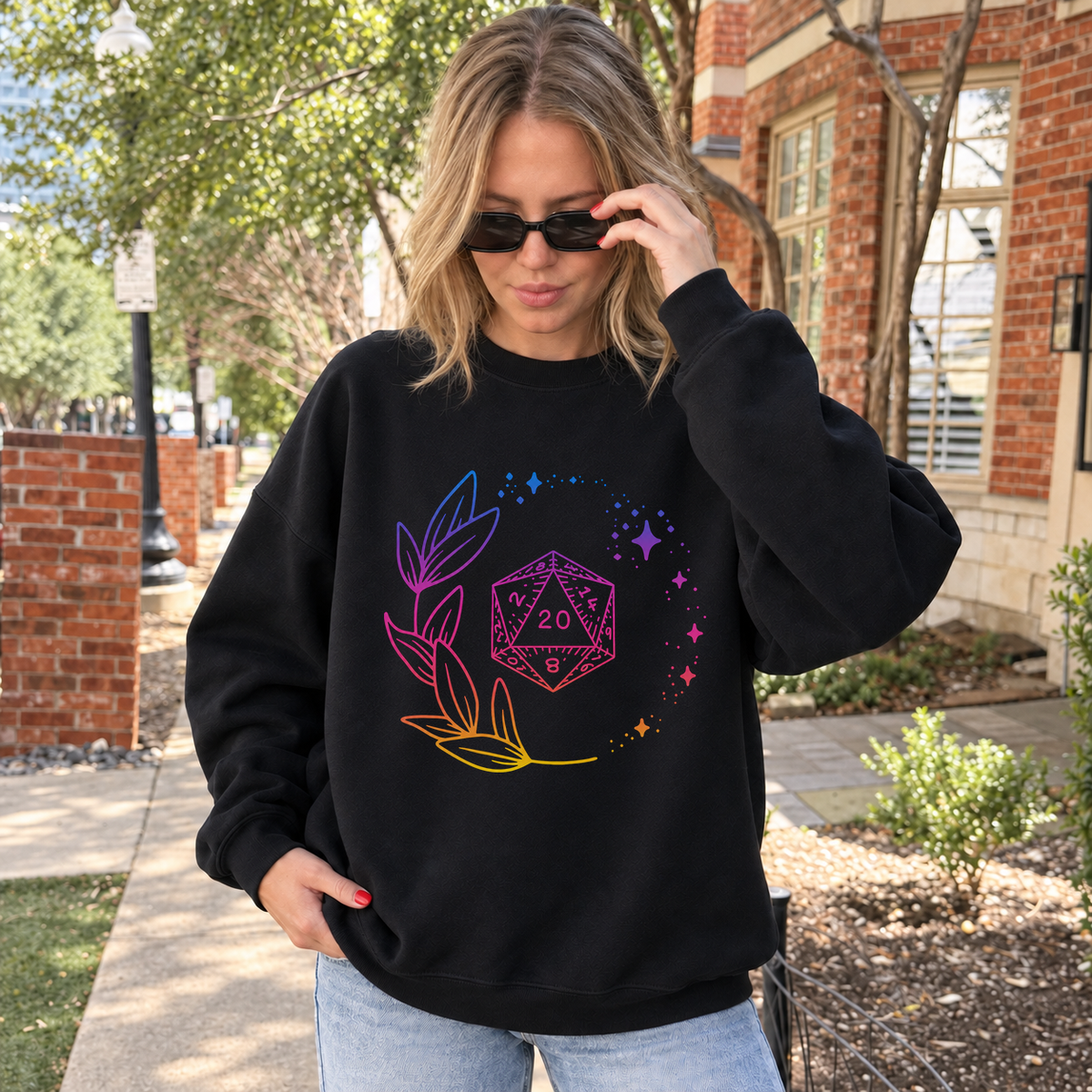 Neon Floral D20 black DnD sweatshirt worn by a woman outdoors