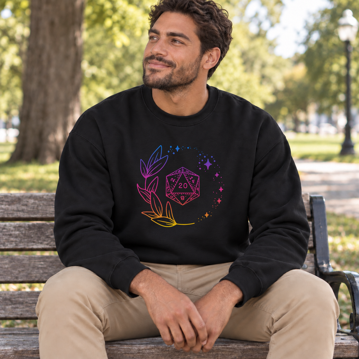 Neon Floral D20 black DnD sweatshirt worn by a man in a park