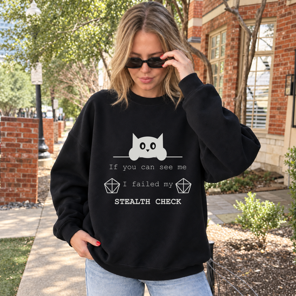 Failed Stealth Cat black DnD sweatshirt worn by a woman outdoors