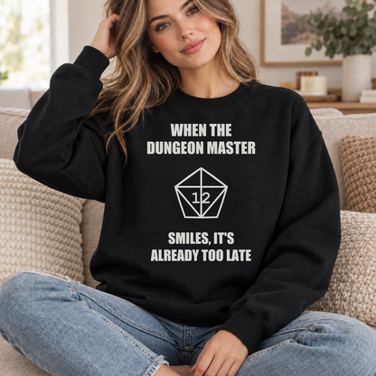 The Dungeon Master Smiles black DnD sweatshirt worn by a woman indoors