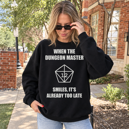 The Dungeon Master Smiles black DnD sweatshirt worn by a woman outdoors